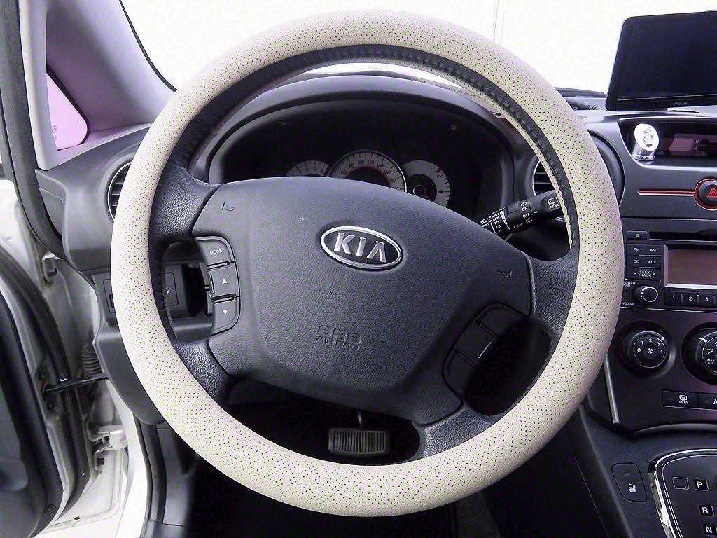 KIA Carens - Vista 11